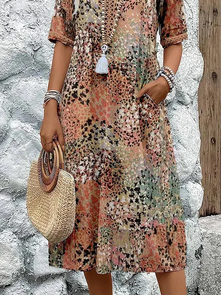 Stylish women's vibrant pattern midi dress, flowing silhouette, elegant design, flattering fit, summer occasion.