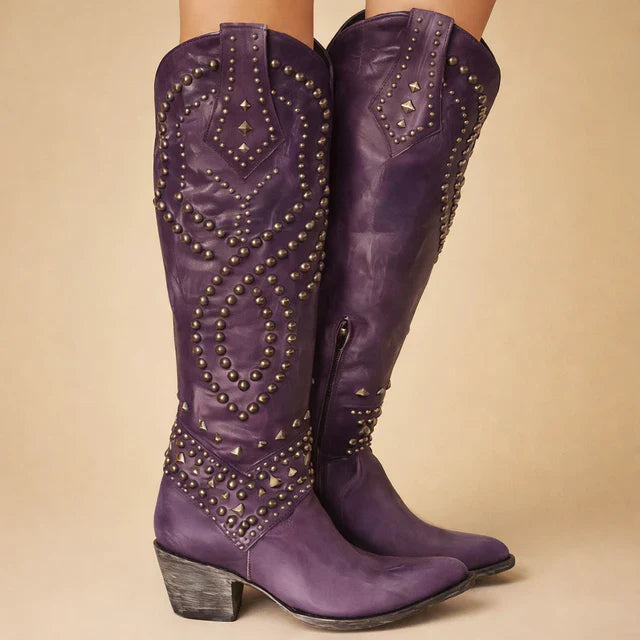 Bold women's vintage knee-high cowboy boots. Western-style fashion with studded details & chunky heel for a statement look.