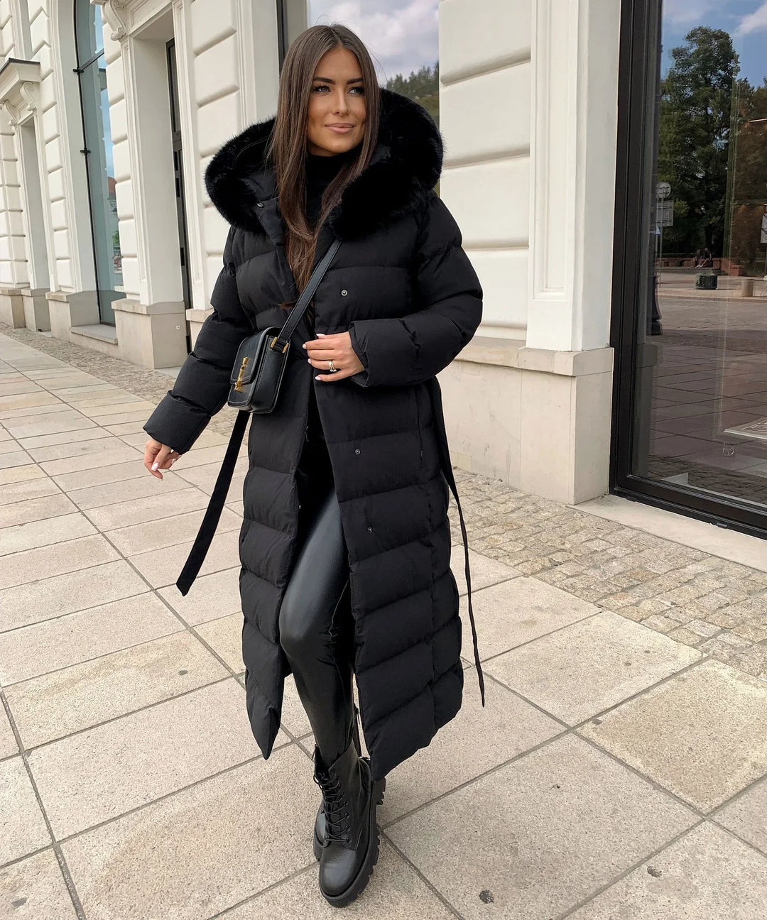 Long women's puffer winter jacket, maxi length for superior warmth. Ideal for cold weather style & comfort.