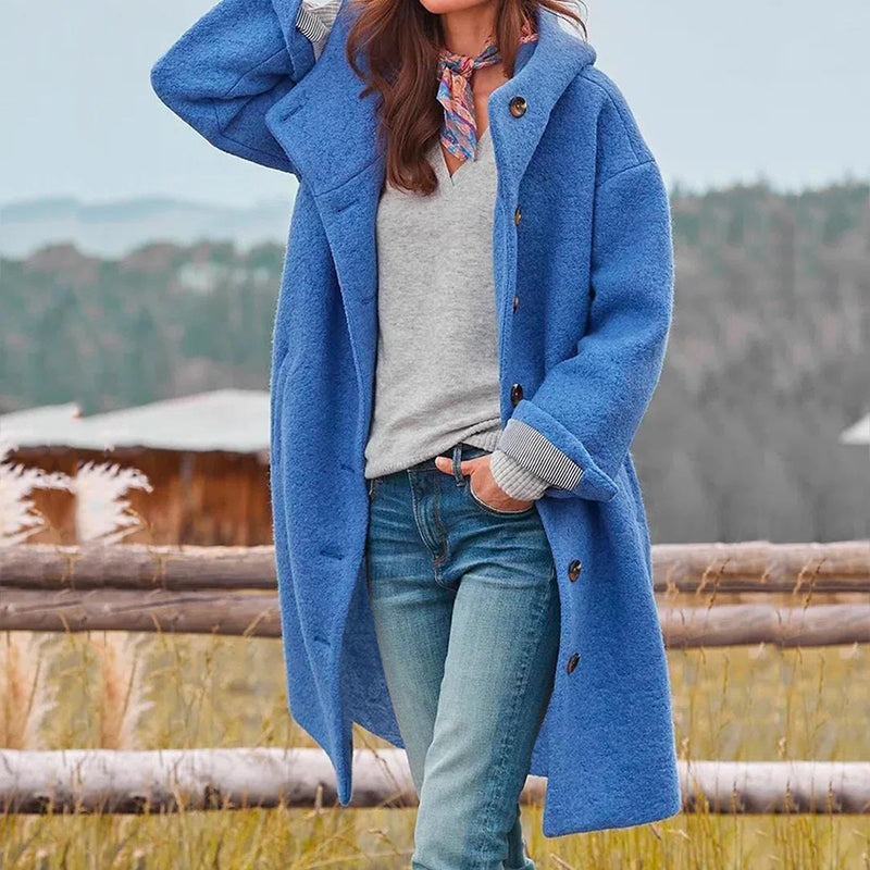 Elegant women's long hooded winter coat. Stylish, warm outerwear for winter fashion. Cozy & comfortable relaxed fit.