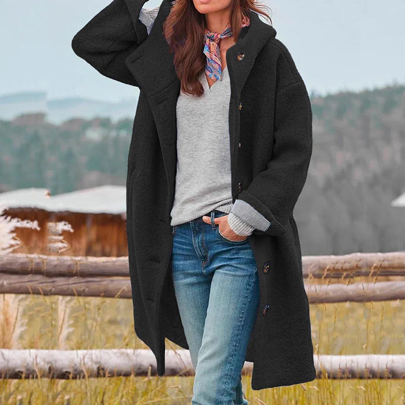 Cozy & warm women's hooded winter coat. Elegant outerwear with a relaxed fit for ultimate comfort and style in winter.