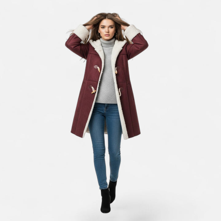 Practical pockets on a women's warm hooded button-front winter coat. Keeps hands cozy.