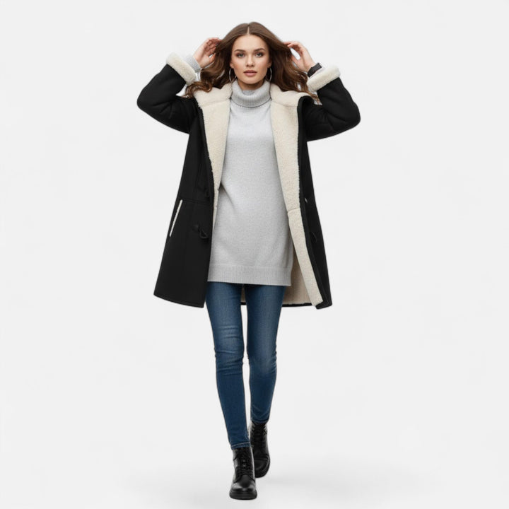 Women's stylish winter jacket. Hooded, button-front, with a comfortable fit and useful pockets.