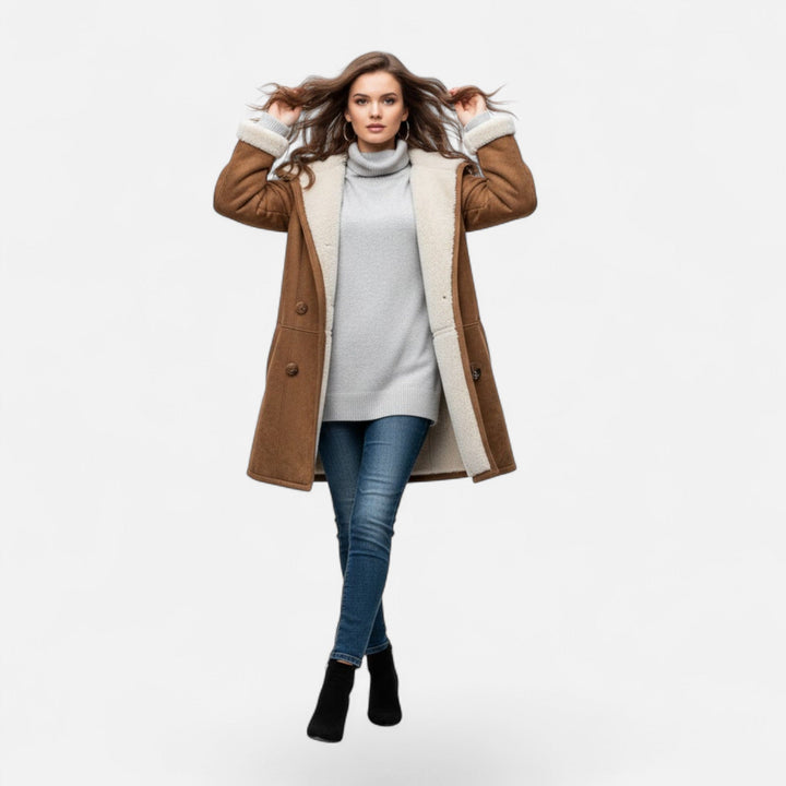 Detail of the soft, warm fabric of a women's hooded winter coat with button-front closure.
