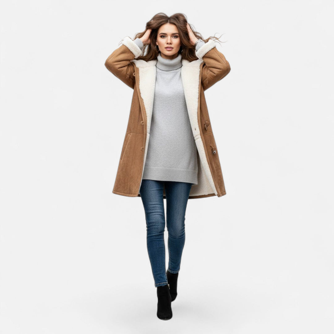 Durable women's hooded winter coat. Button-front, warm, and practical with spacious pockets.