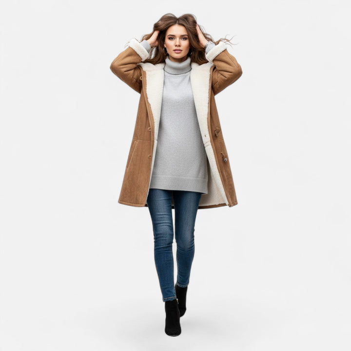 Durable women's hooded winter coat. Button-front, warm, and practical with spacious pockets.