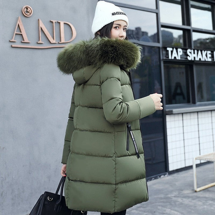 Women's warm long winter parka with a cozy hood, offering stylish everyday protection against cold weather.
