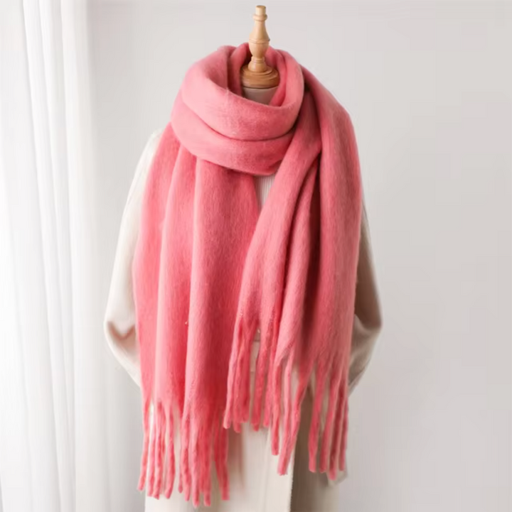 Soft women's winter accessory, a warm pashmina-style scarf with elegant fringes & cozy comfort.