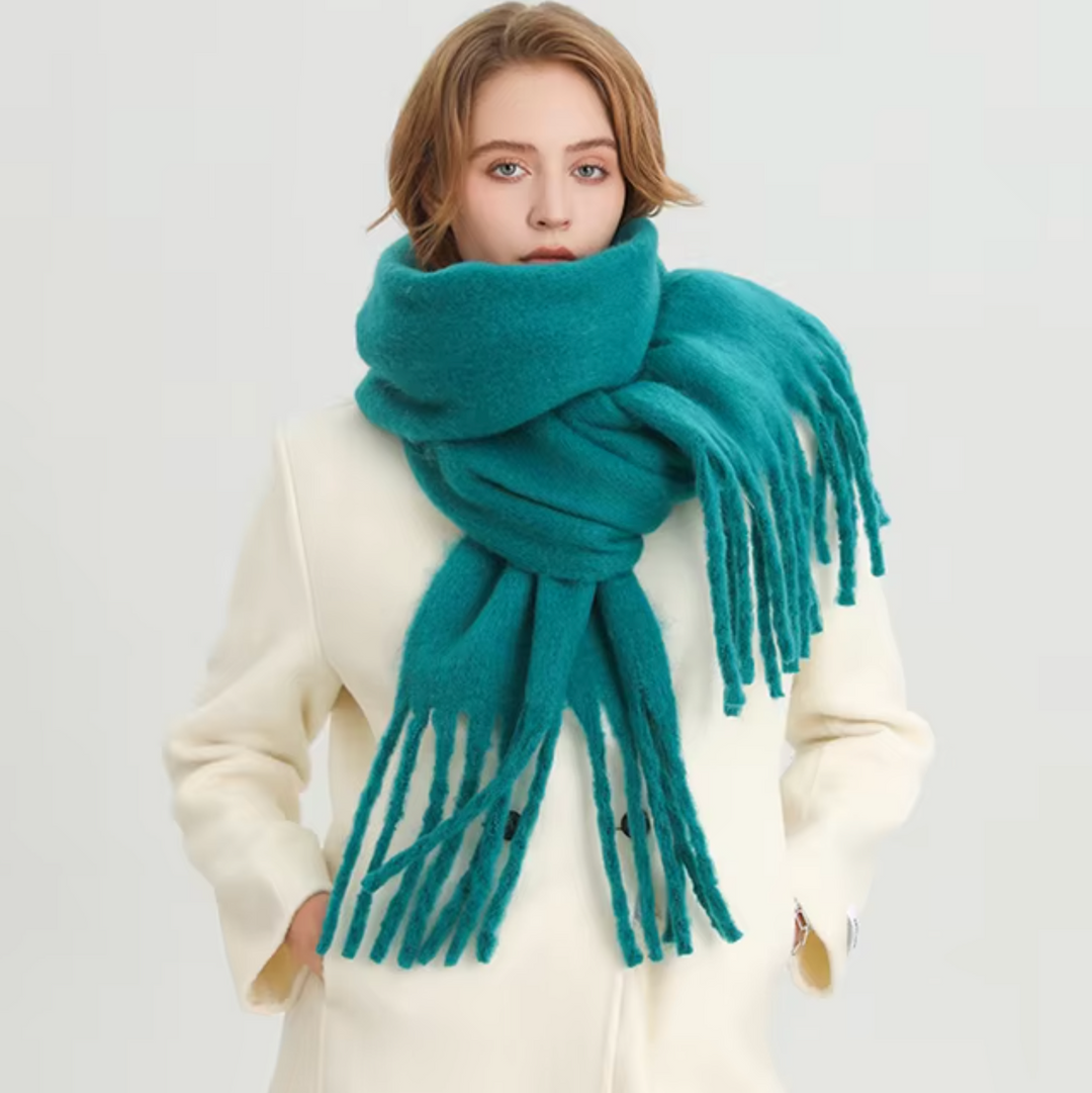 Soft women's winter scarf, a warm accessory with elegant fringes, perfect for cold weather.