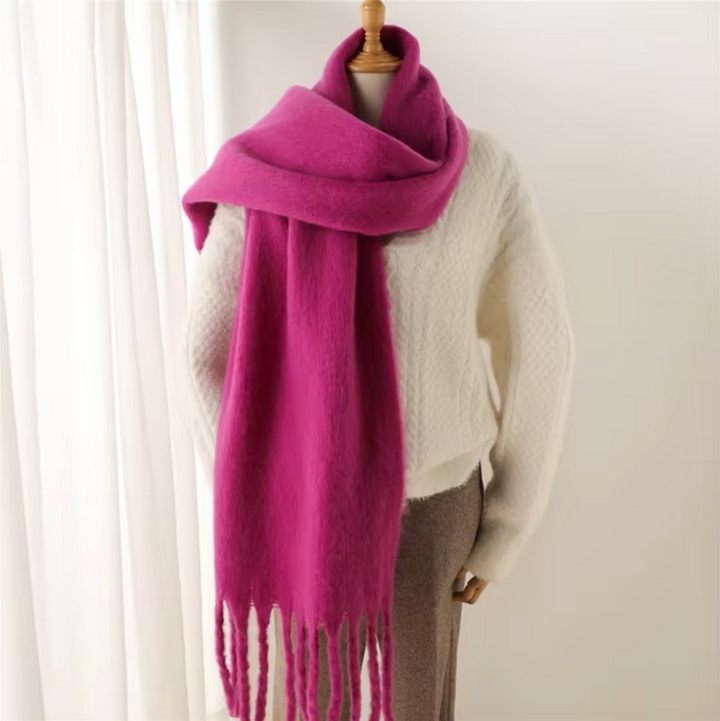 Versatile women's cozy wrap, a stylish winter accessory with fashionable fringes.