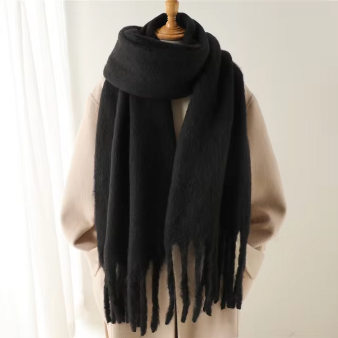 Comfortable & warm women's winter scarf with soft fringes, ideal for cozy styling.