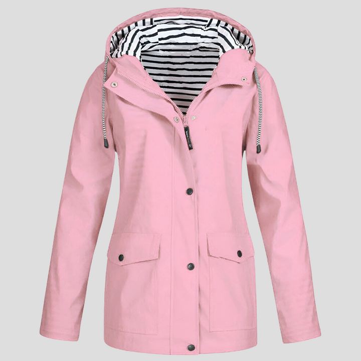 Comfortable women's water-resistant windbreaker jacket with a hood, essential for outdoor travel.