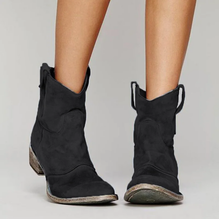 Fashionable women's pull-on Western ankle boots, ideal for casual fall and winter outfits.