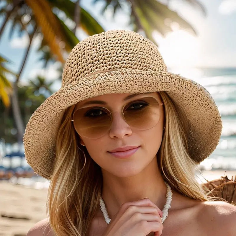 Breathable woven straw sun hat for women. Wide brim offers excellent sun protection for summer outings.