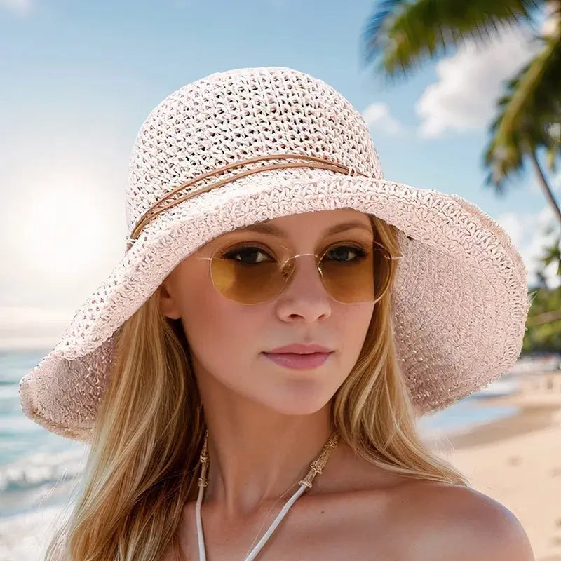 Classic woven straw wide brim sun hat for women, essential summer fashion accessory with sun protection.