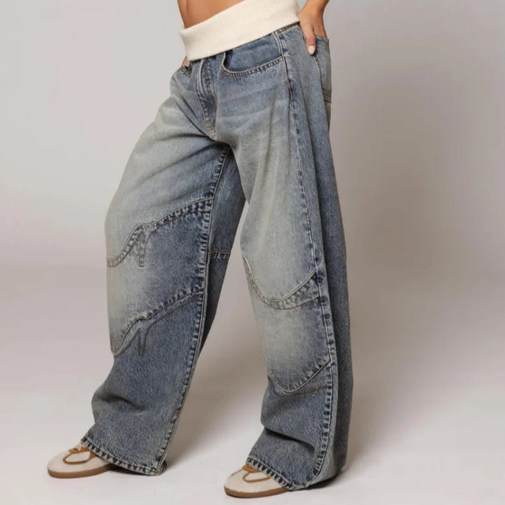 Trendy women's oversized baggy wide leg jeans, featuring a unique ribbed waist and light blue Y2K style.