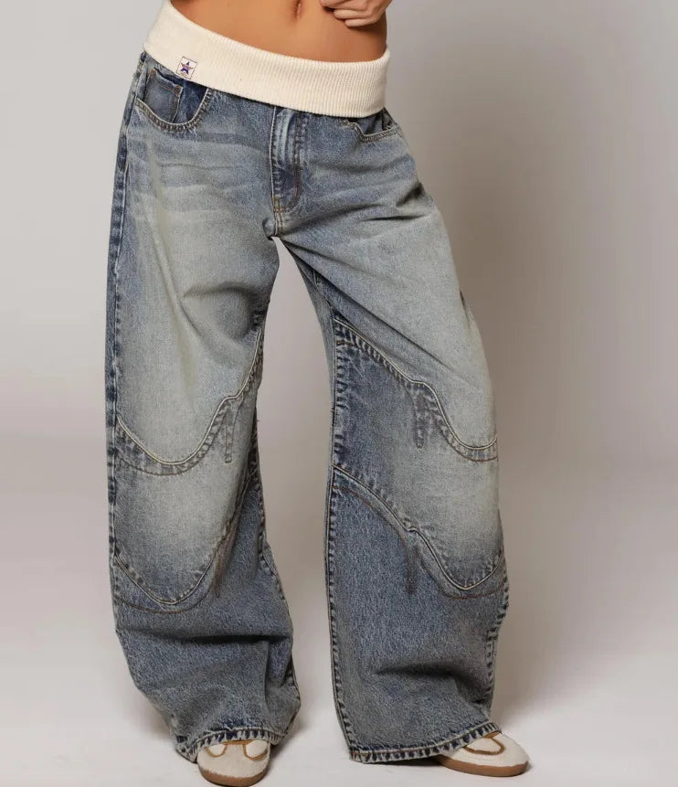 Women's casual light blue Y2K baggy wide leg jeans with a comfortable ribbed waist, perfect for everyday style.