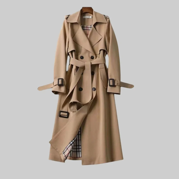 Women's classic beige double-breasted trench coat with a stylish belted waist for elegant outerwear.