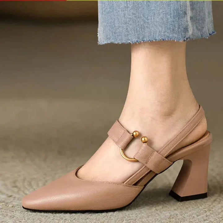 "Women's beige orthopedic high heels with wide base, offering support and style for comfort and confidence all day."