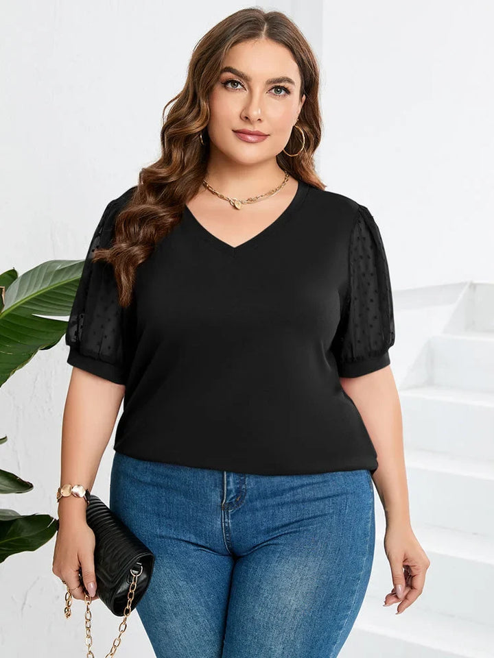 Women's black knit blouse with dotted puff sleeves and a chic V-neck, perfect for elegant fashion.