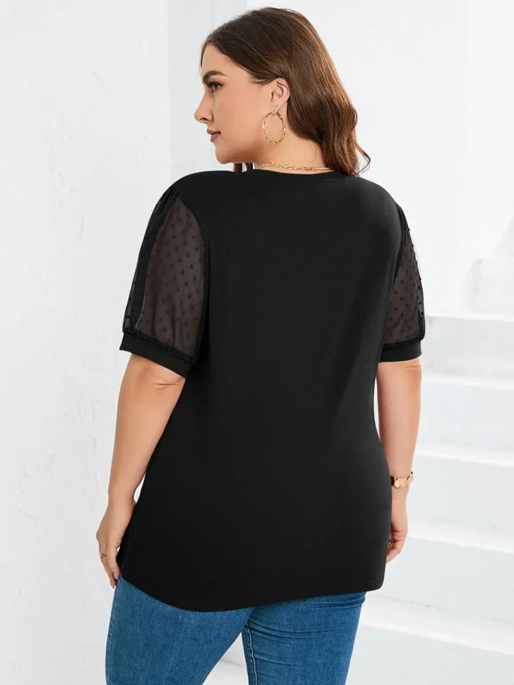 Black knit women's V-neck blouse with dotted puff sleeves. Elegant and versatile fashion top.
