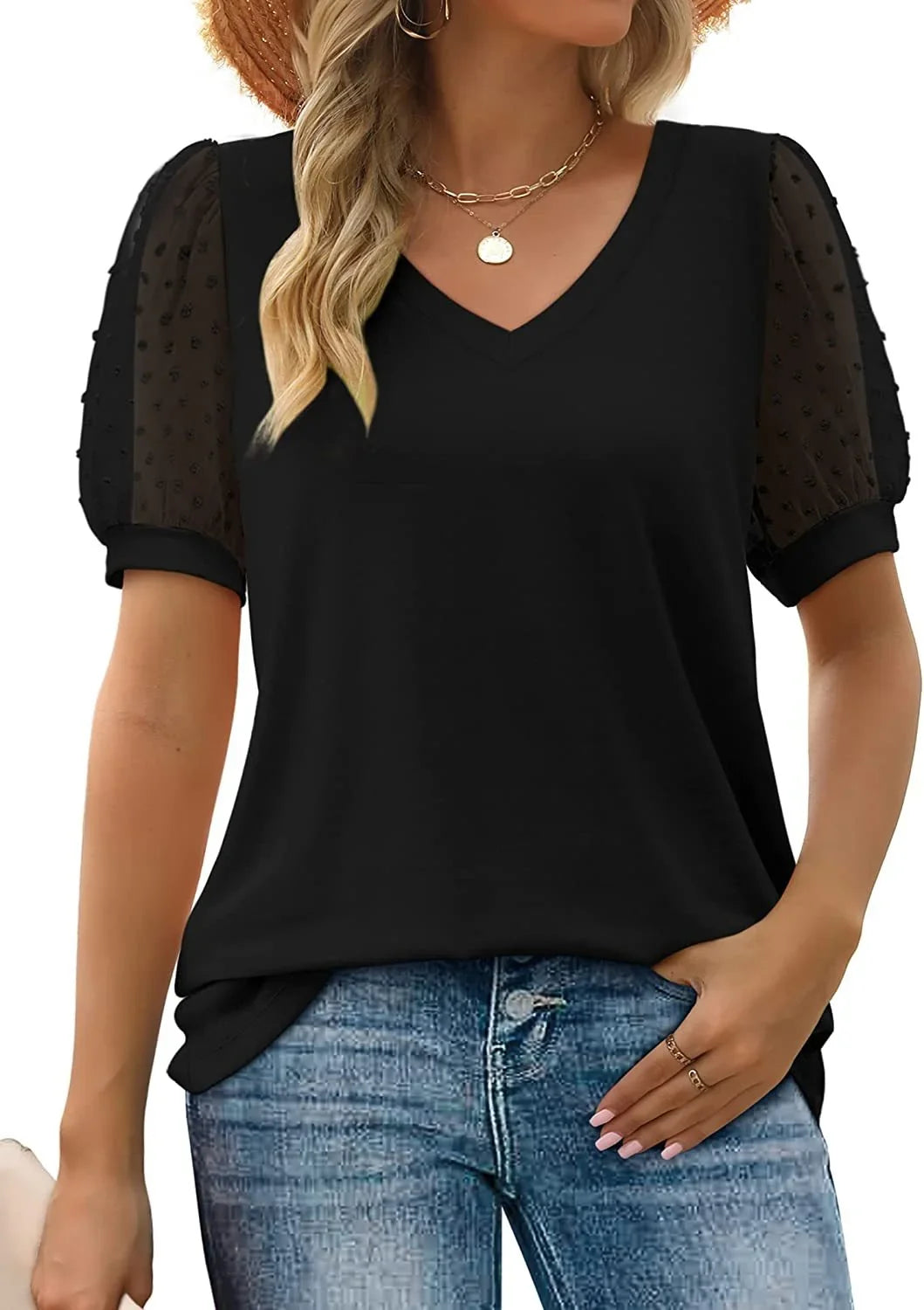 Stylish women's black top with a flattering V-neck, delicate dotted pattern, and trendy puff sleeves. Knit fabric.