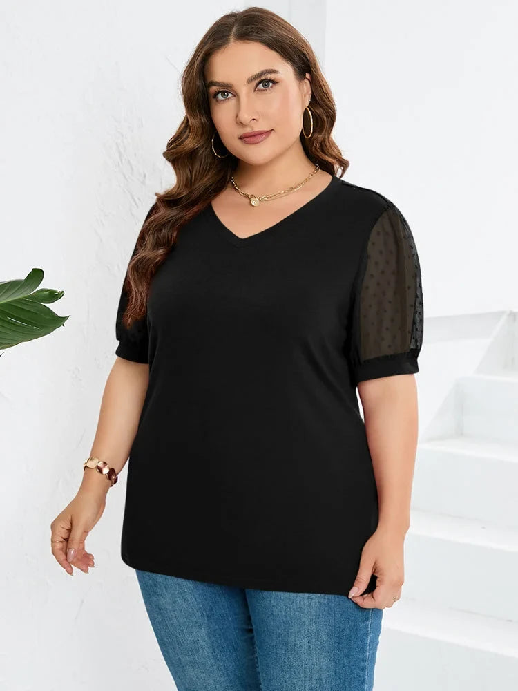 Comfortable knit black blouse for women, featuring a flattering V-neck and stylish dotted puff sleeves.