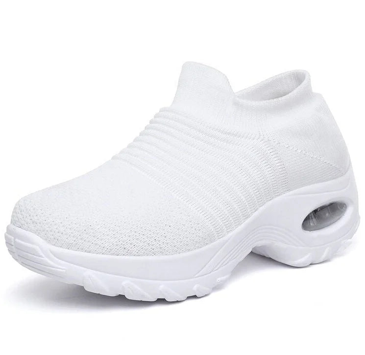 Athletic style women's slip-on sneakers with superior arch support and air cushioning for active wear.