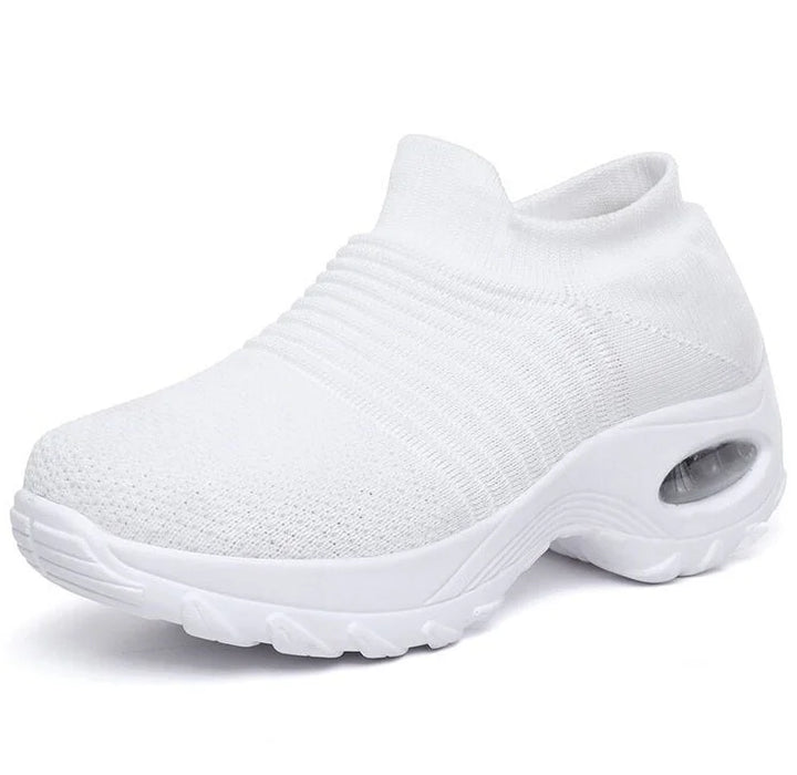 Athletic style women's slip-on sneakers with superior arch support and air cushioning for active wear.