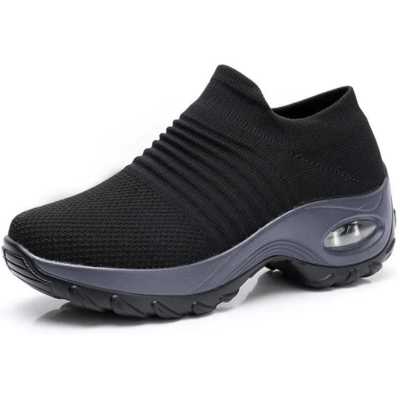 Black women's slip-on sneakers, lightweight, with arch support for daily comfort and casual footwear.