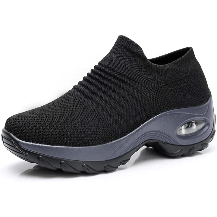 Black women's slip-on sneakers, lightweight, with arch support for daily comfort and casual footwear.