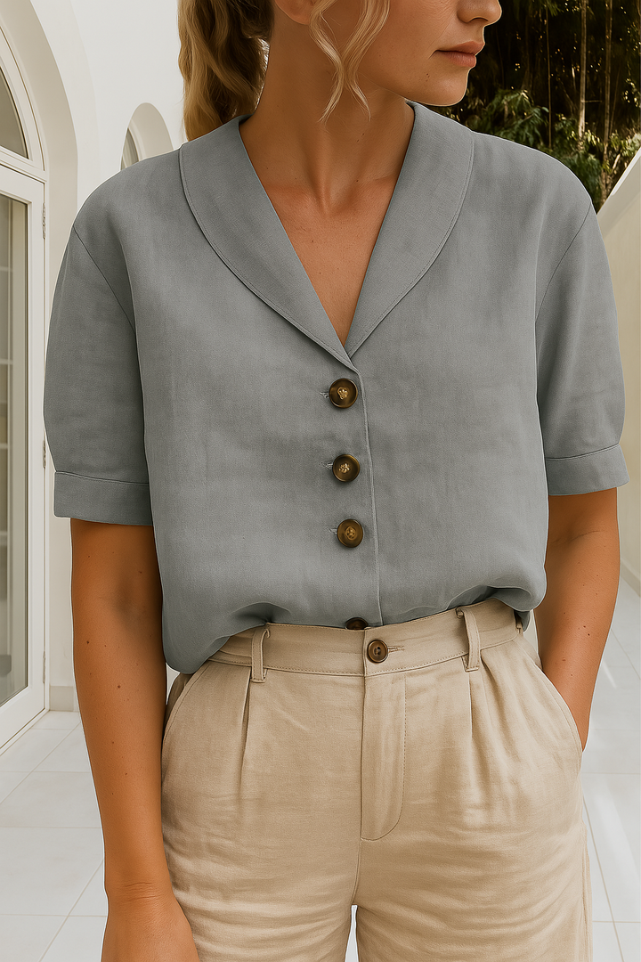 Comfortable women's short sleeve blouse with an elegant shawl collar and button-front. Great for office or everyday wear.