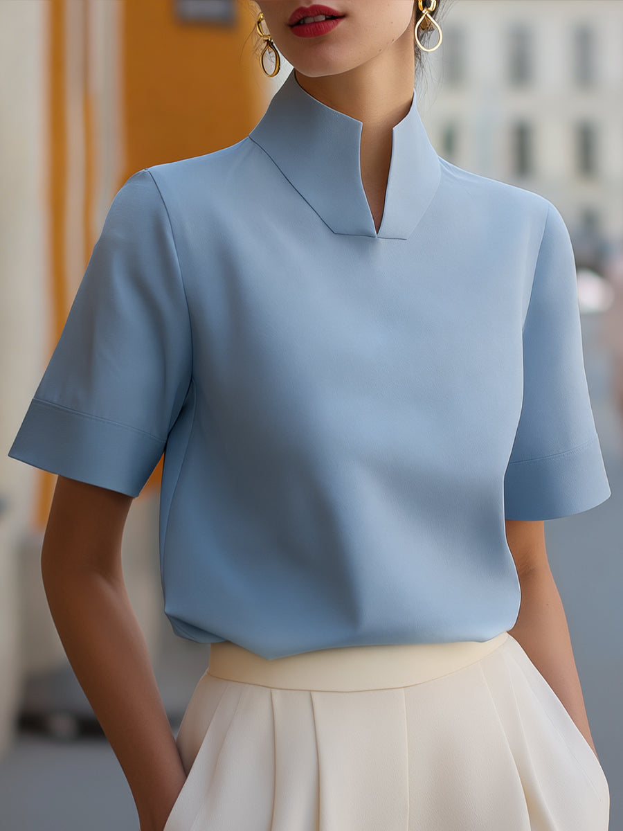 Stylish short sleeve stand-collar blouse for women. Ideal for office wear, work, or an elegant everyday look.