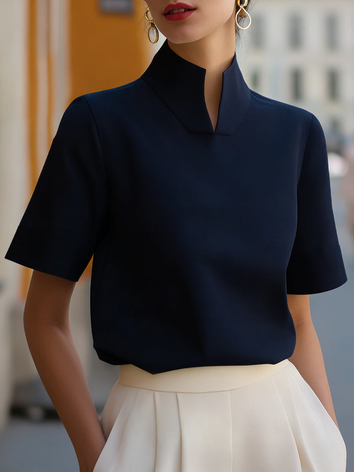 Versatile women's stand-collar short sleeve top. Elegant design suitable for work, casual, or everyday fashion.