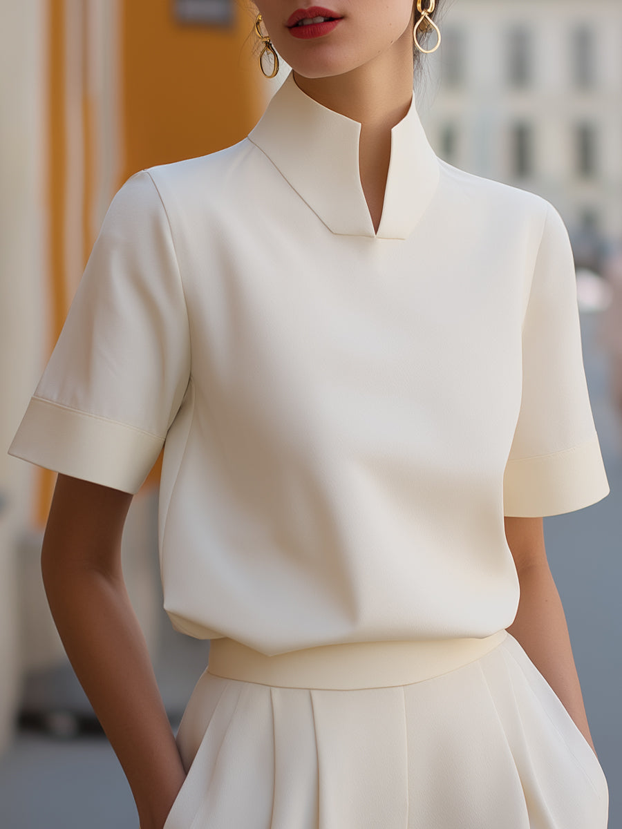 Elegant women's stand-collar short sleeve blouse for office or casual wear. Chic and versatile everyday top.