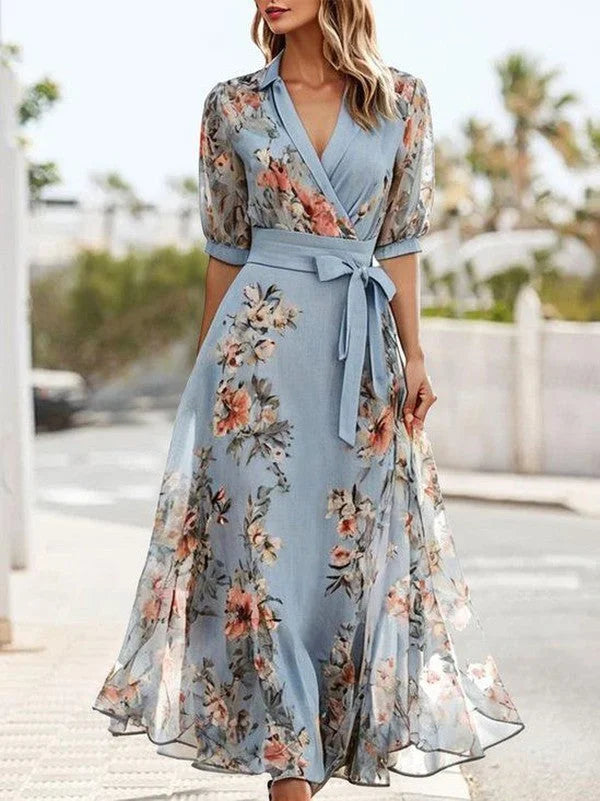 Women's blue floral midi dress with V-neck, puff sleeves, and tie waist for elegant summer & spring fashion.