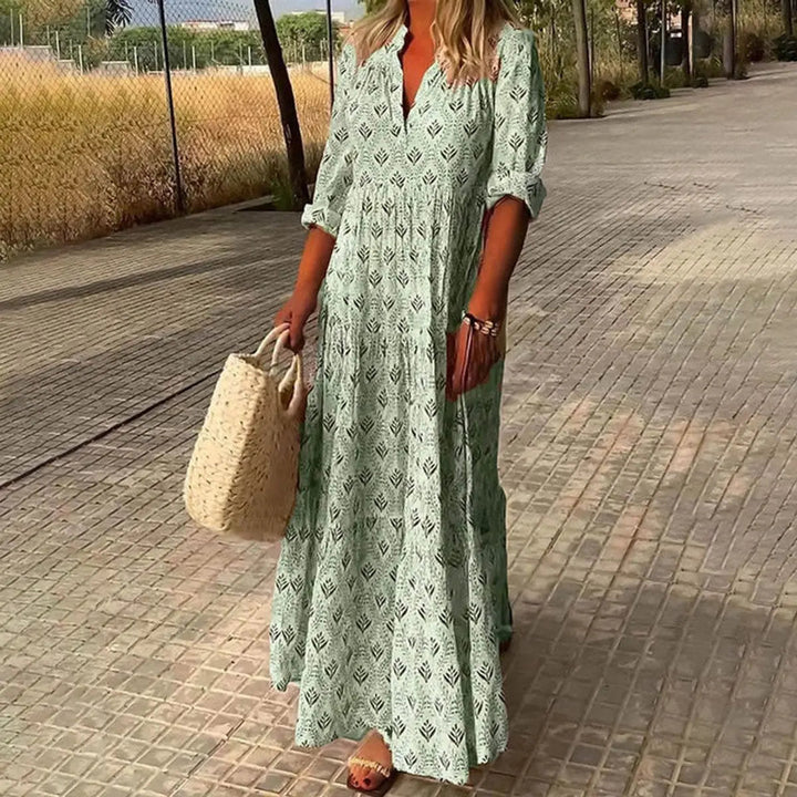 Long sleeve boho floral print maxi dress for women, featuring a V-neck and tiered skirt, ideal for autumn/winter events.