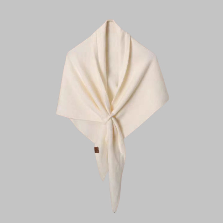 Bold striped women's triangle shawl, a versatile seasonal fashion accessory.