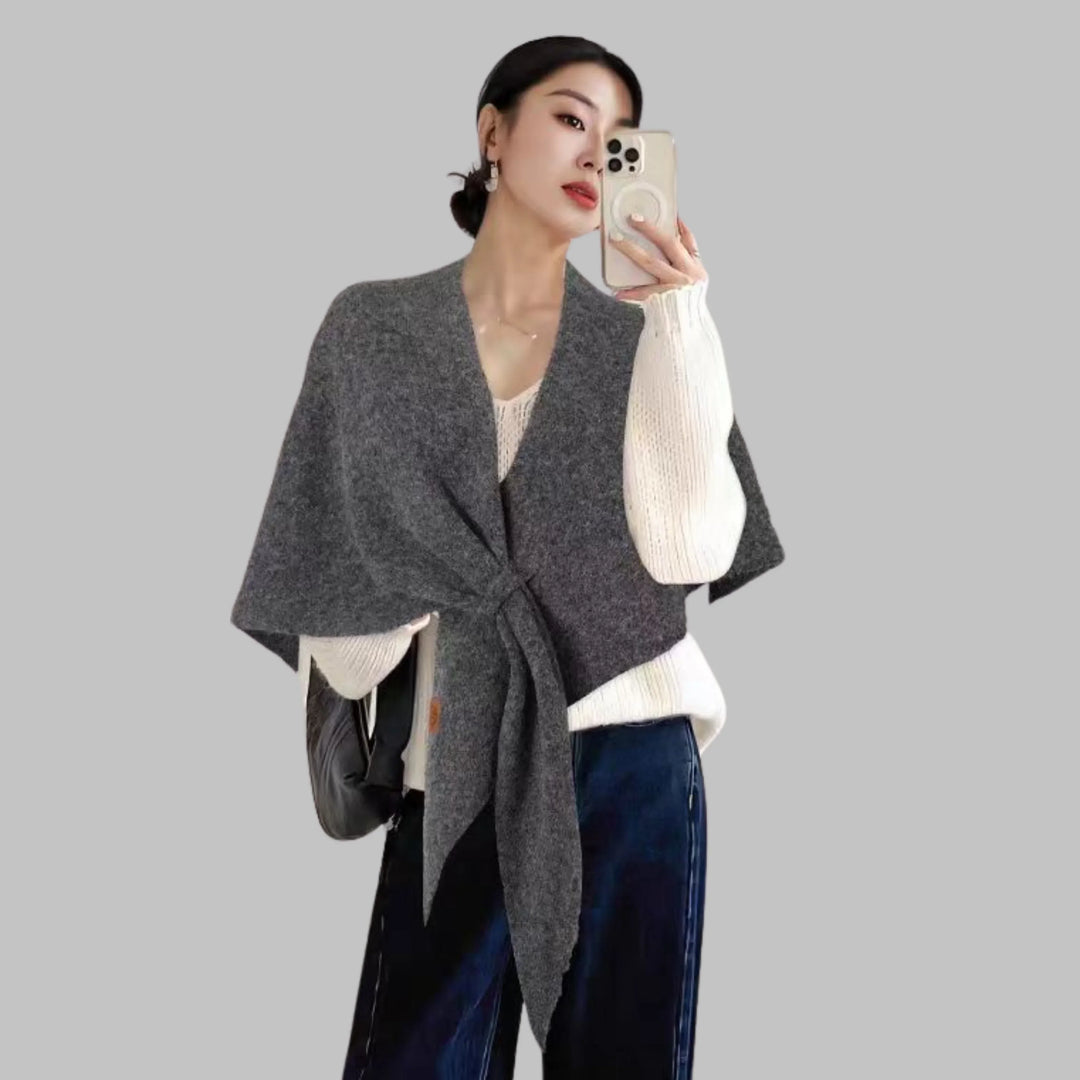 Layering women's accessory: bold striped triangle shawl, a fashionable and cozy choice.