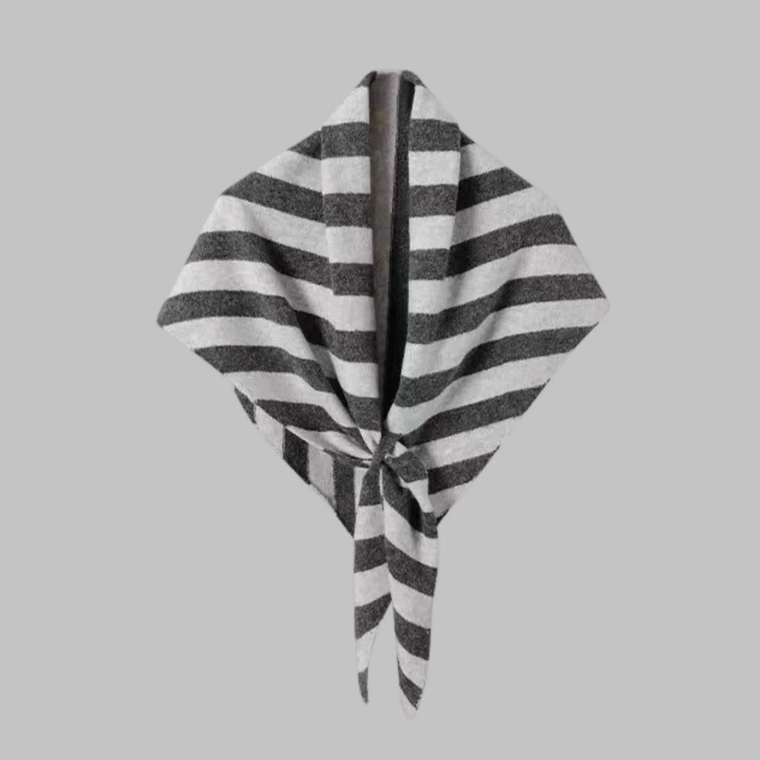 Fashionable women's wrap with bold stripes, a statement triangle design accessory.