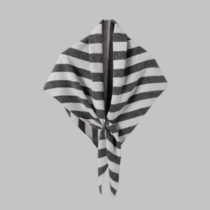 Fashionable women's wrap with bold stripes, a statement triangle design accessory.