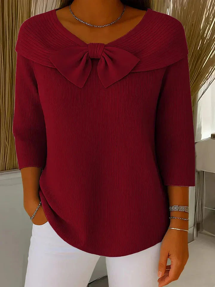 Maroon V-neck women's sweater with trendy 3/4 sleeves & a charming bow detail. Feminine and chic top.