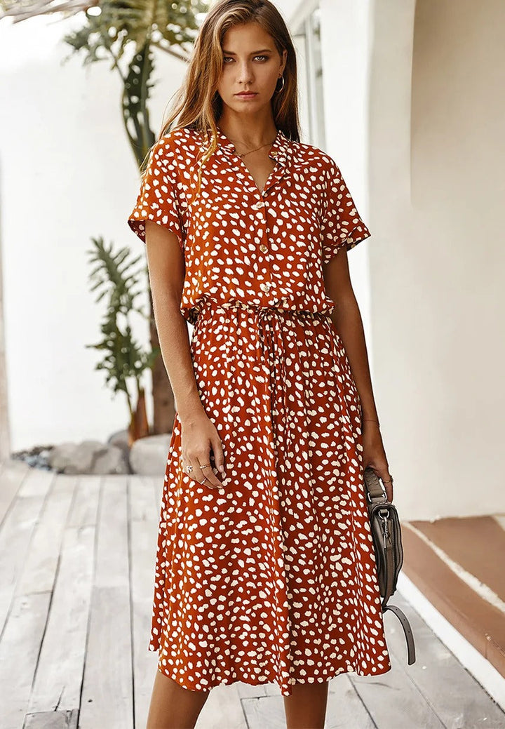 Women's breathable black midi dress, button front, relaxed fit with short sleeves, perfect for summer comfort and style.