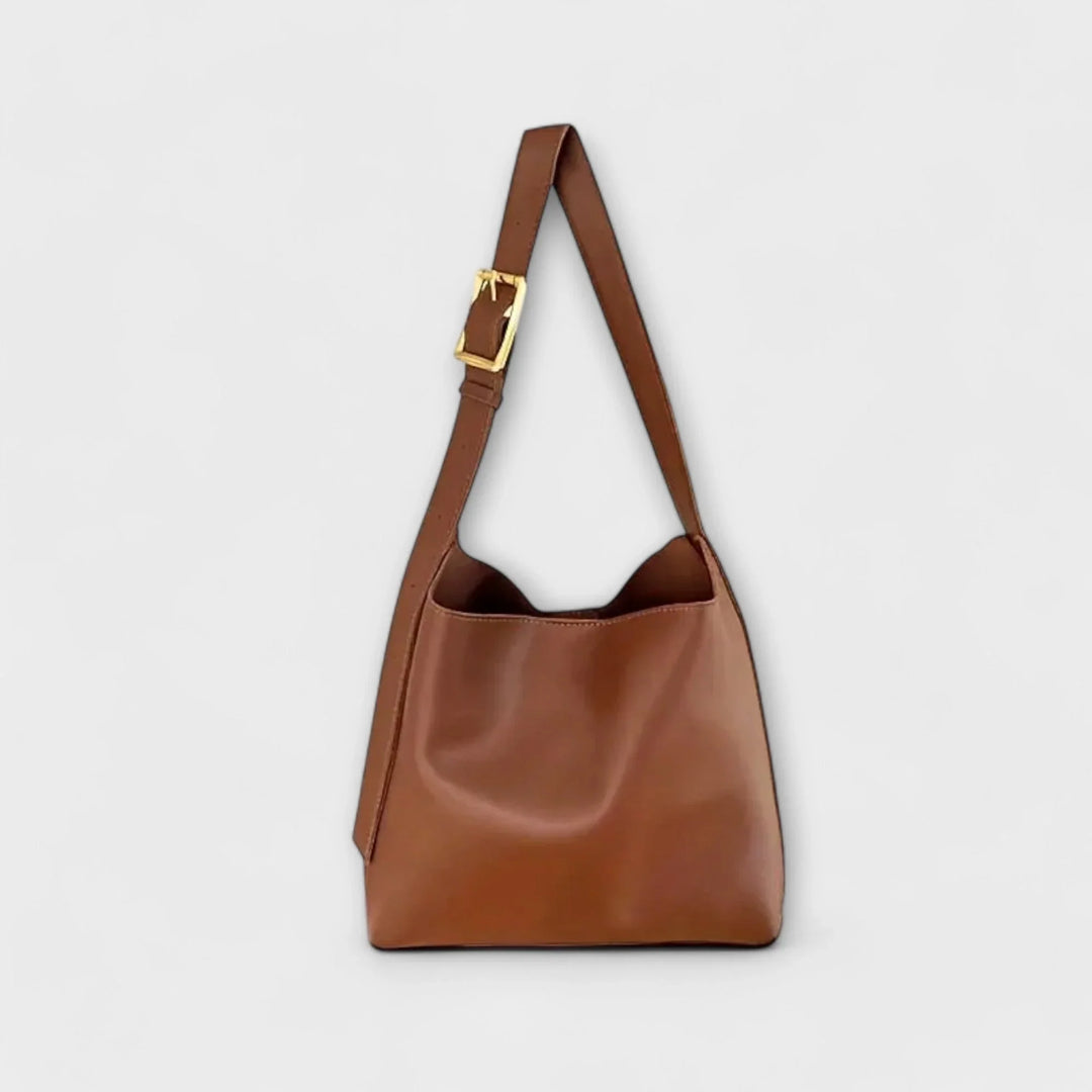 Women's faux leather hobo shoulder bag with adjustable strap, perfect for everyday use.