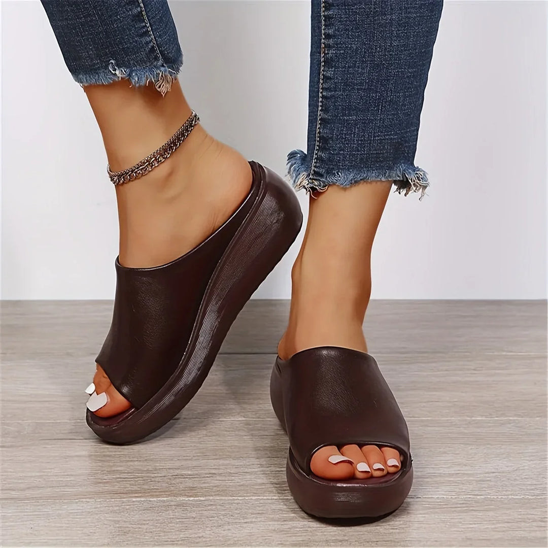 Brown open-toe wedge sandals, women's slip-on style. Comfortable footwear for casual summer fashion.