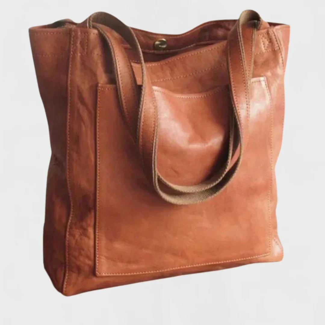 Women's stylish brown leather tote bag with a practical front pocket, ideal for work & everyday use.