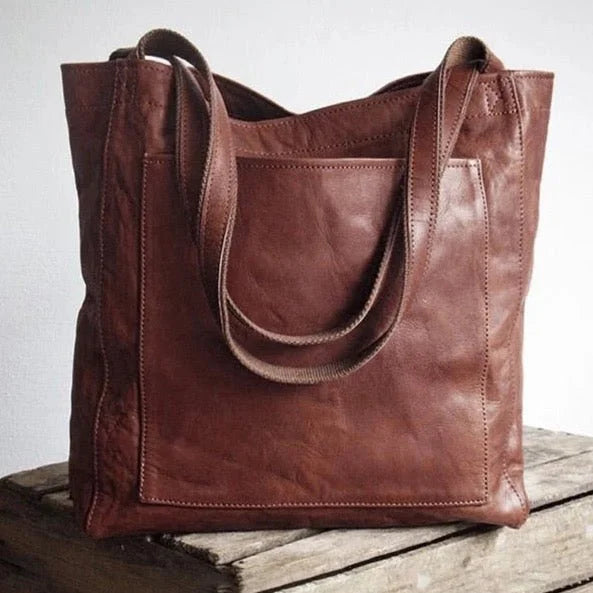 Versatile women's brown leather shoulder bag, a stylish and spacious everyday tote with magnetic closure.