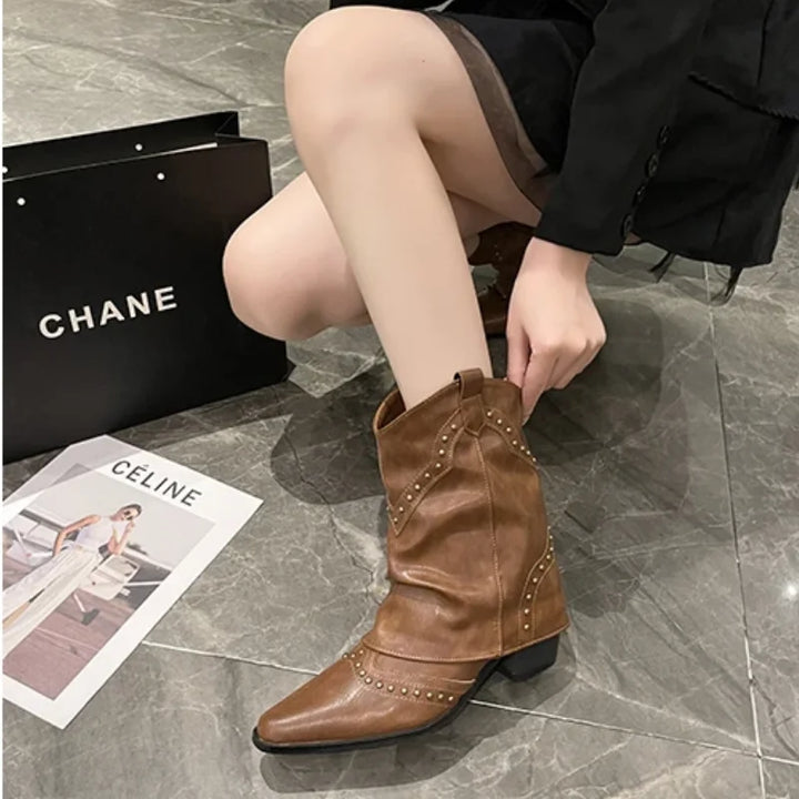 Pointed toe women's boots, studded western mid-calf style, edgy and bold.