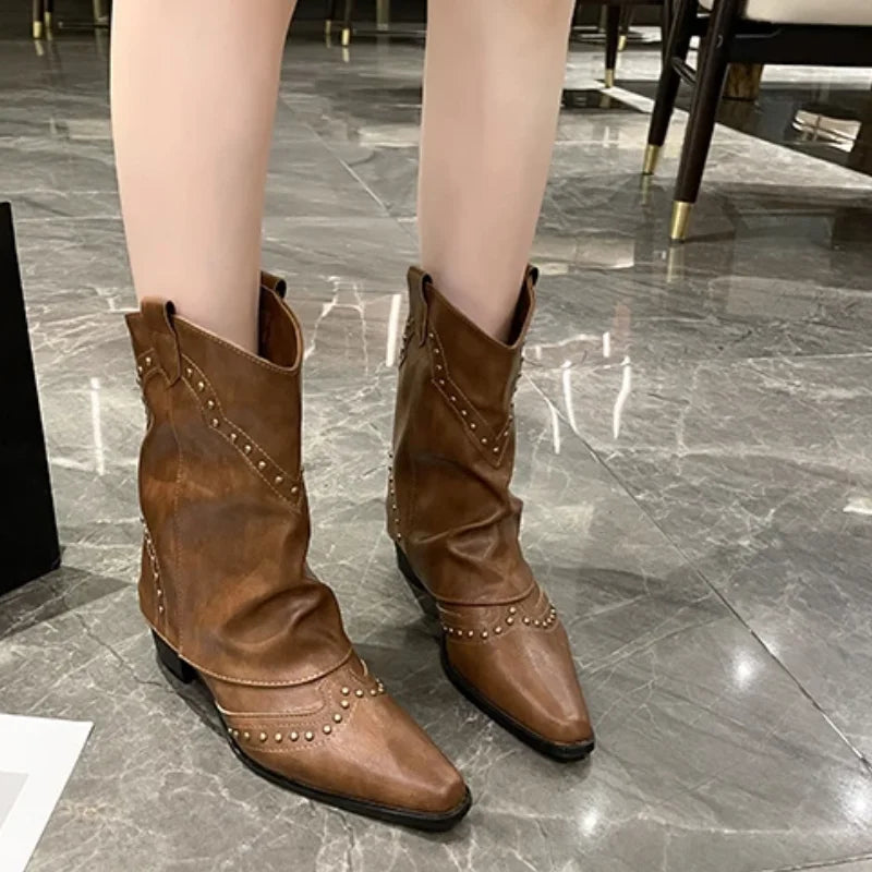 Western studded boots for women, mid-calf height, chic pointed toe, fashion statement.