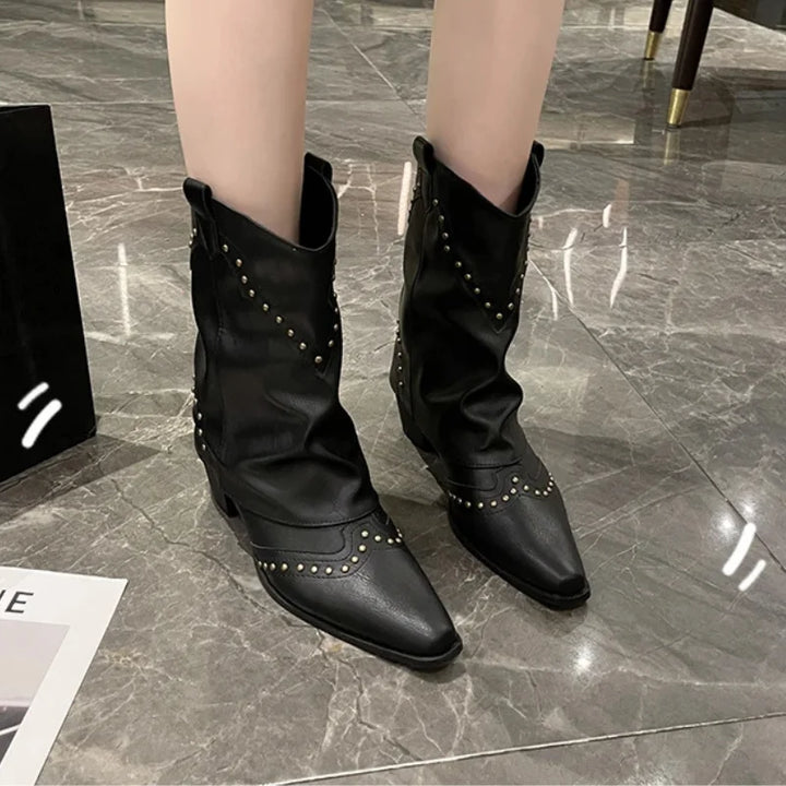 Stylish women's studded western boots, mid-calf, pointed toe, fashion-forward design.